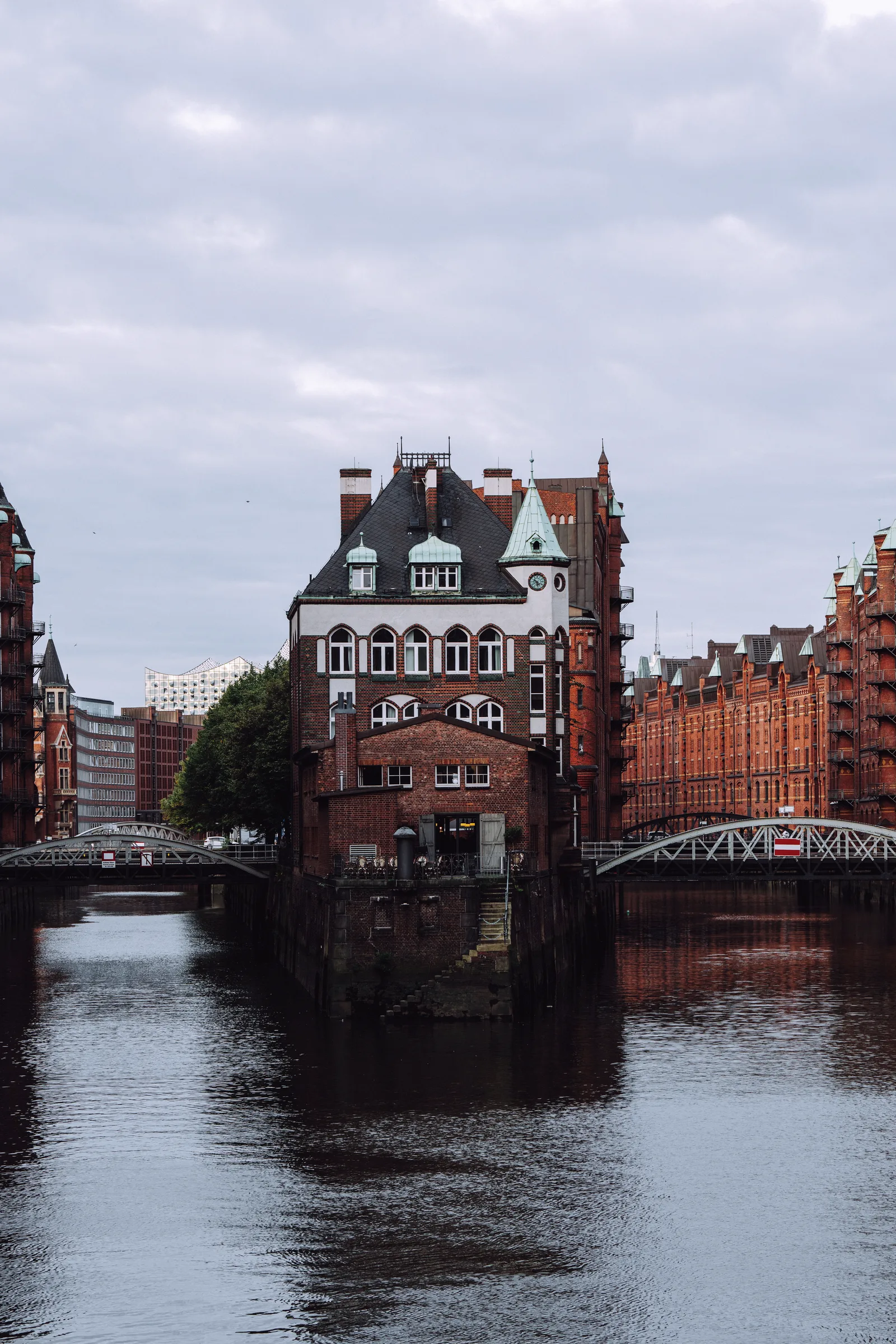 The Wasserschloss in Hamburg’s Speicherstadt, mirrored in the canal