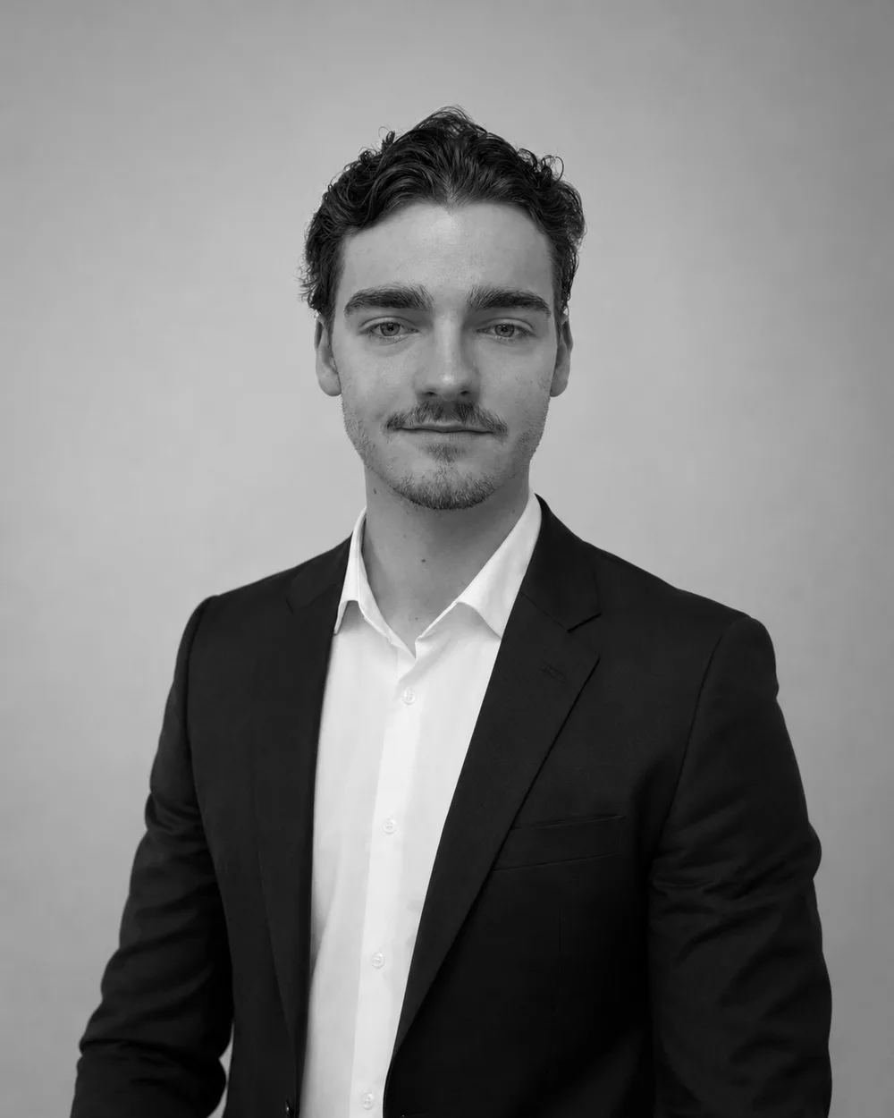 Kimi Wendel, co-founder of Volantic, in a dark suit — black-and-white portrait